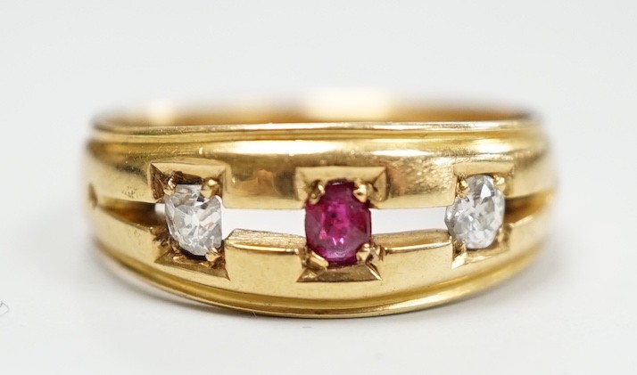 A late Victorian 18ct gold, ruby and diamond set three stone ring, size K/L, gross weight 4 grams.